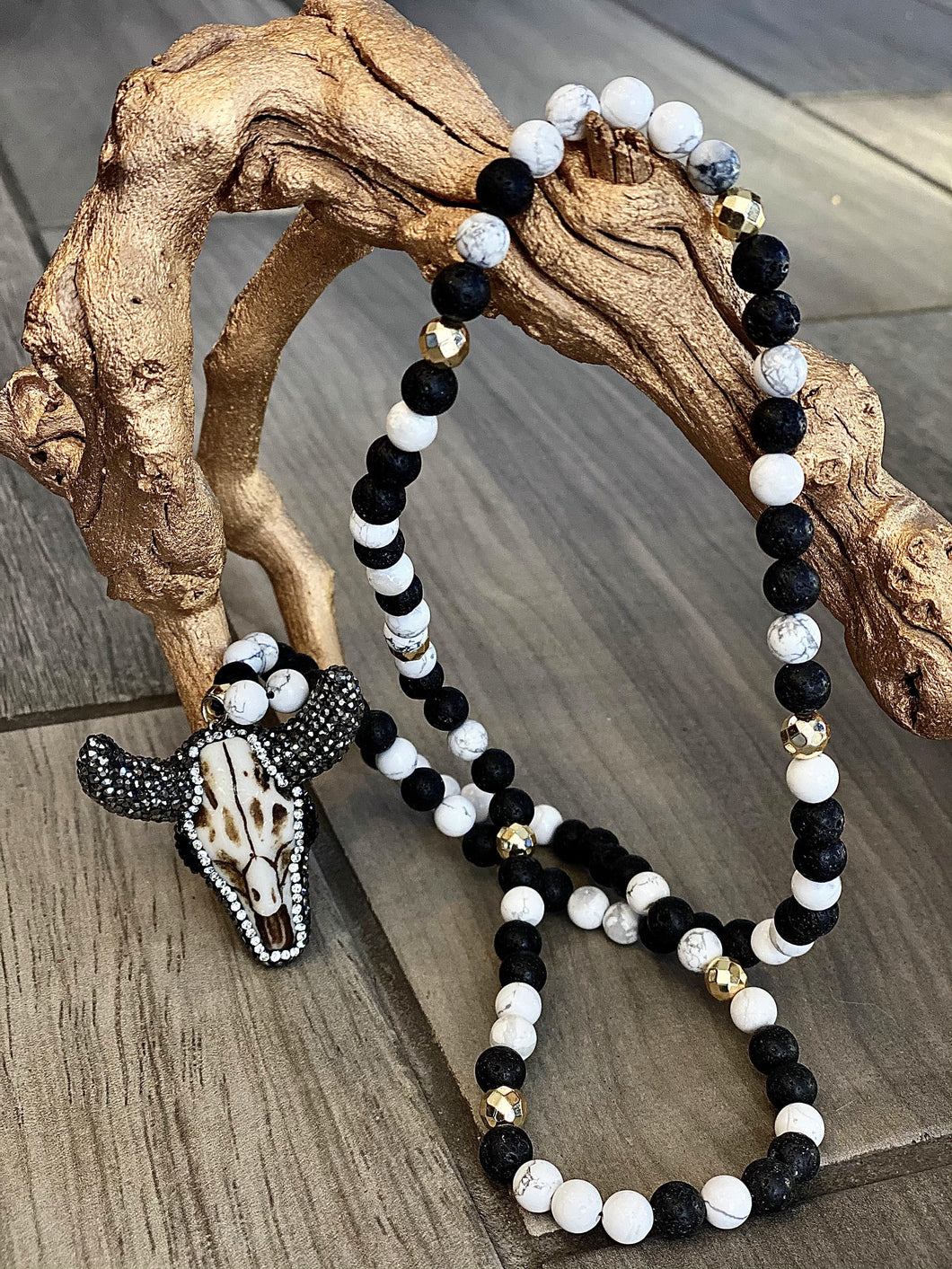 Black and white beaded ox head pendant necklace